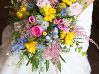 Roses, Delphiniums, Wax Flower, Astilbe, Freesia textured cascade bridal bouquet